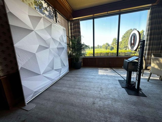 Galaxy open-air photo booth with a white geometric backdrop set up at a Sacramento venue