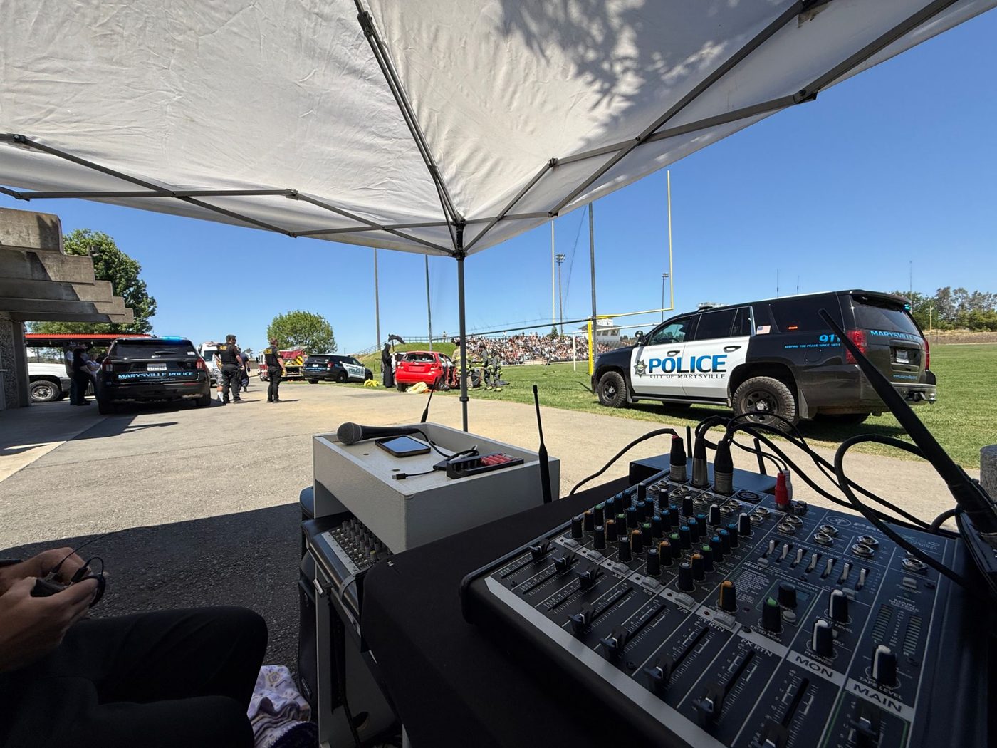 Live sound mixer and wireless mics running an Every 15 Minutes staged collision with police and fire on scene