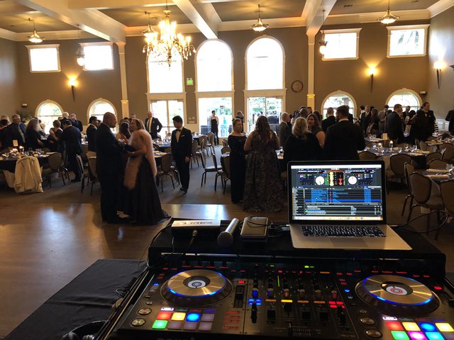 Galaxy DJ mixing live at an elegant ballroom wedding reception